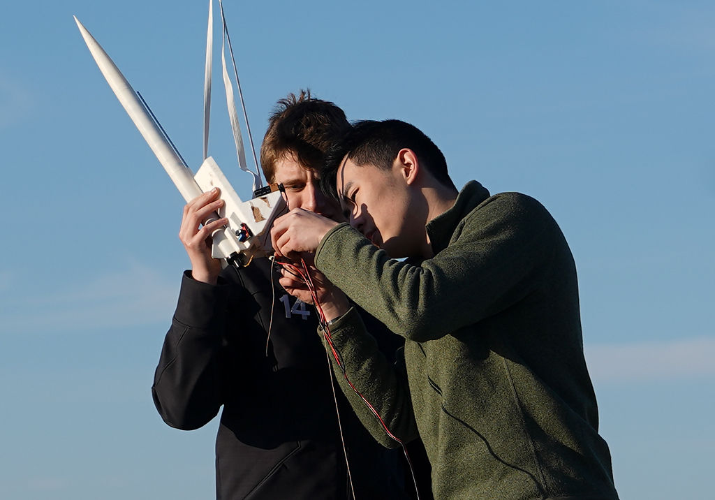 Edward Ge, right, and Jack Goddard troubleshoot problems with the rocket